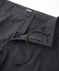 ALLOVER LOGO PATTERN EMBROIDERED NYLON PANTS