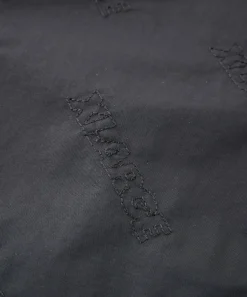 ALLOVER LOGO PATTERN EMBROIDERED NYLON PANTS